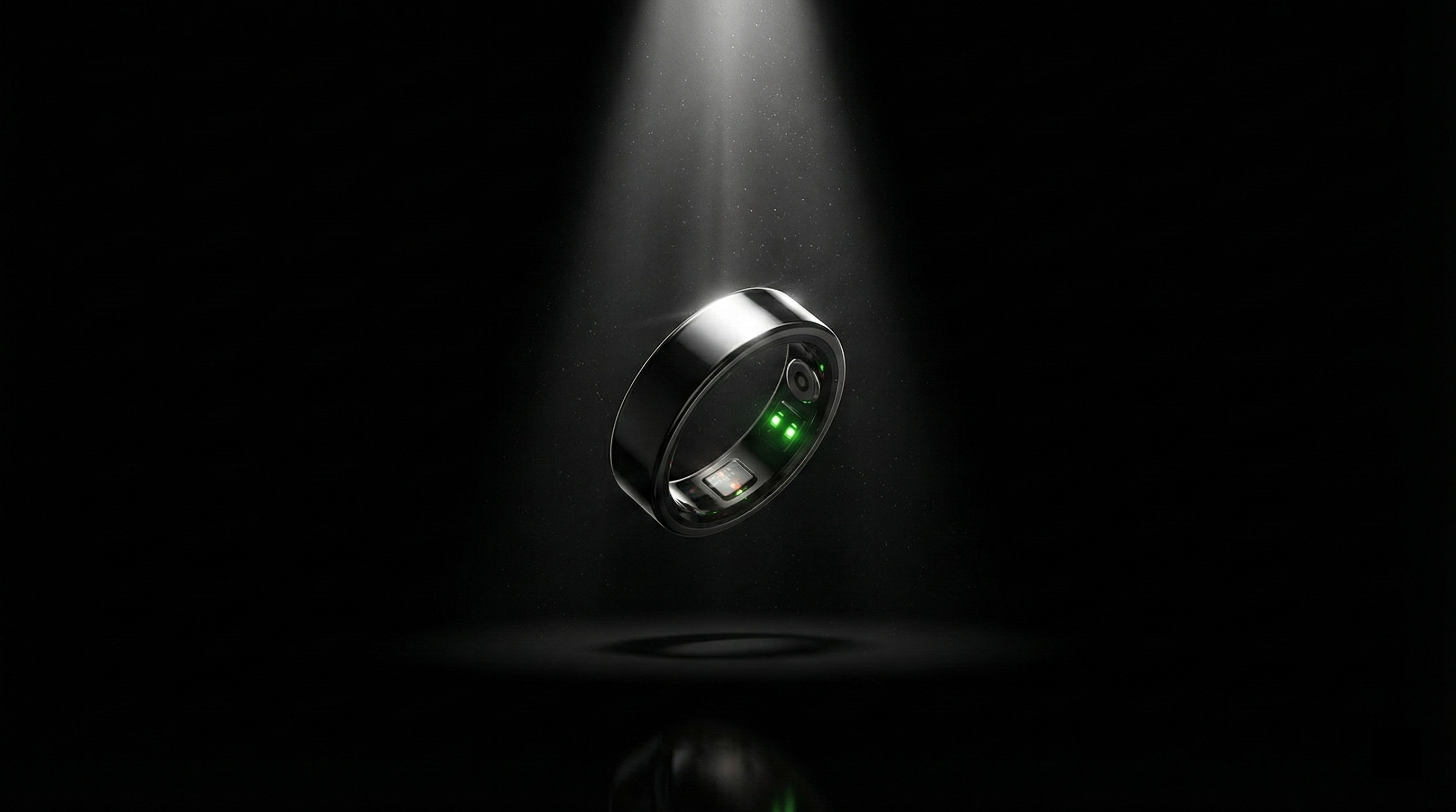 Pulsyn Rune 1 smart ring floating under spotlight with green LED sensors